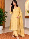 Model wearing a mustard embroidered tunic and trousers with a matching scarf