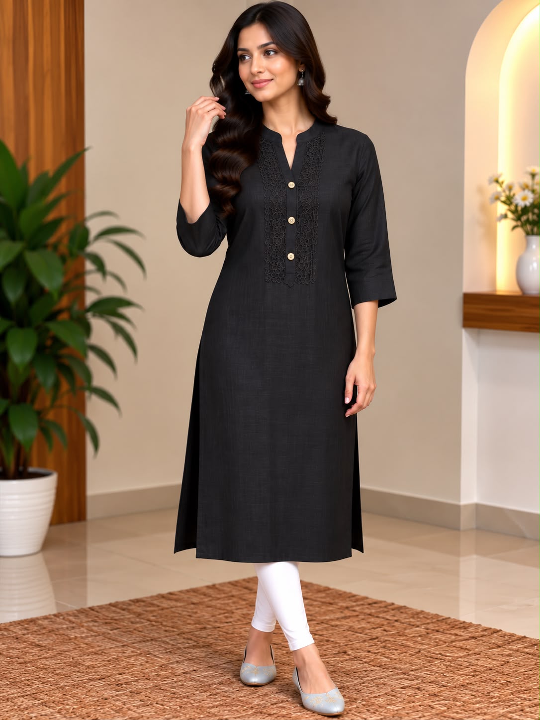 Model wearing a black button-front kurta with three-quarter sleeves