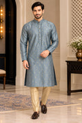 Front view of blue-grey patterned men's kurta styled with beige trousers