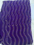 Violetter Saree mit glitzerndem Wellenmuster